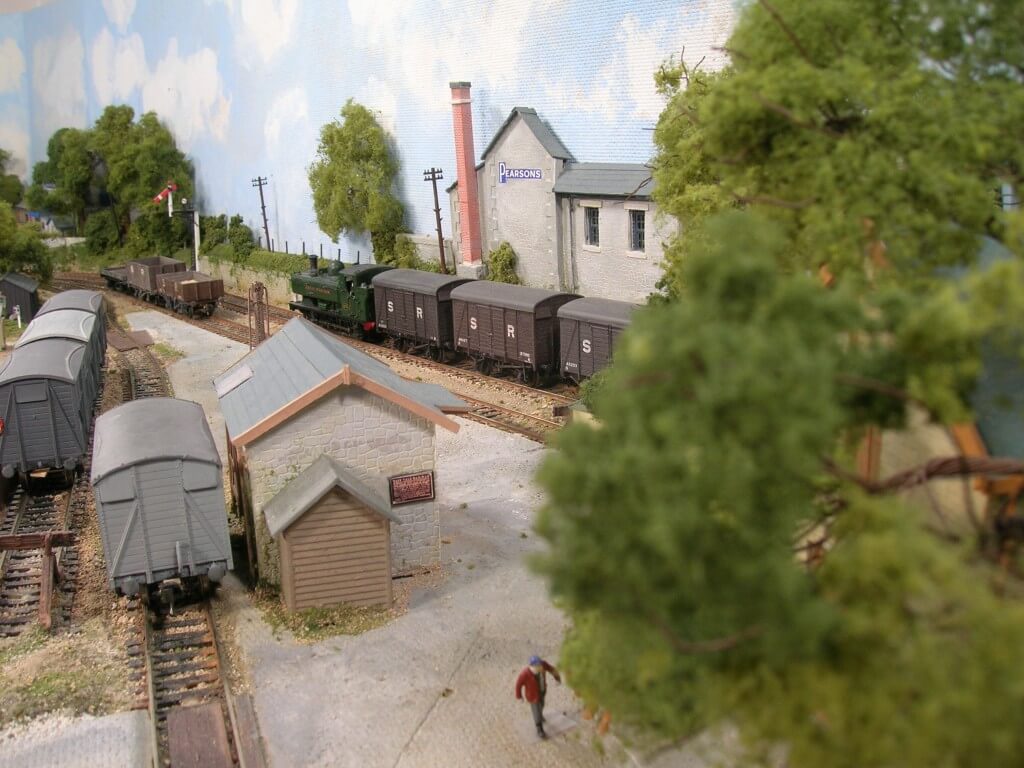 3171 As the empty SR vans arrive to be exchanged with the full GWR, Jake hurries toward the stables.