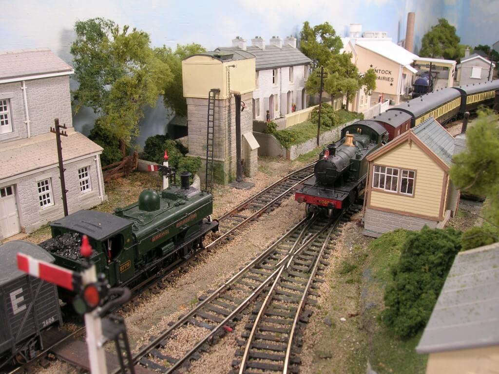 Prairie and pannier between model railway Water Tower and Signal Box.